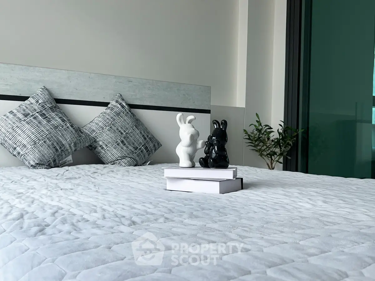 Modern bedroom with stylish decor and cozy bedding