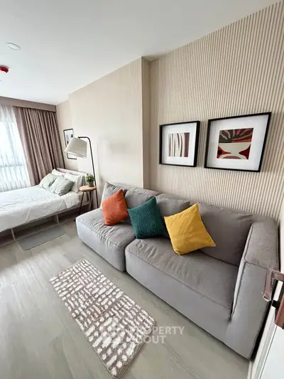 Modern studio apartment with cozy living area and stylish decor