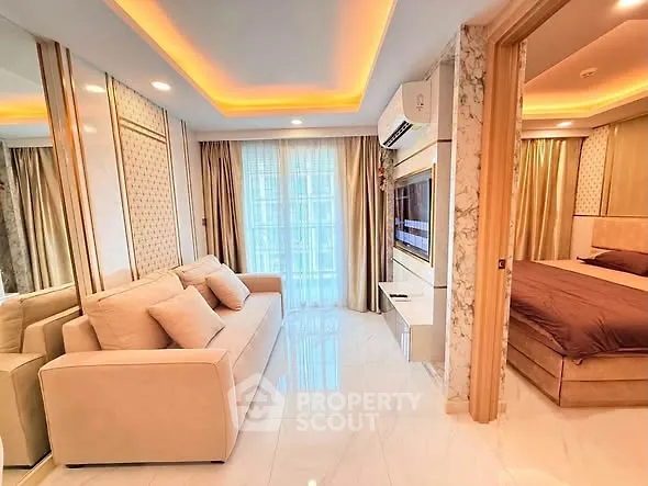 Luxurious modern living room with elegant lighting and cozy bedroom view