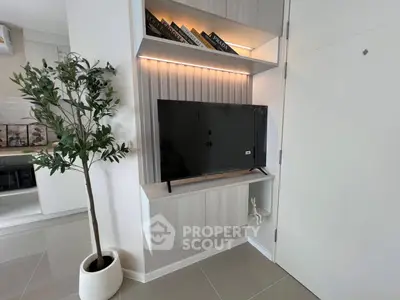 Modern living room corner with sleek TV and stylish shelving