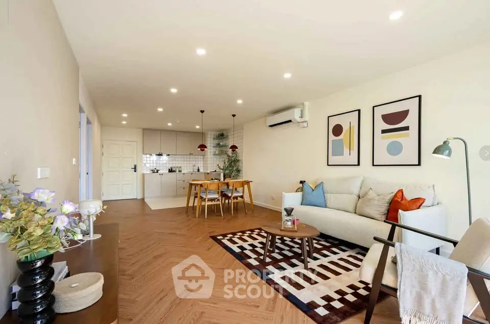 Spacious modern living room with open kitchen and stylish decor