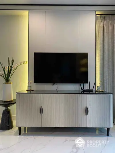 Modern living room with sleek TV stand and elegant decor