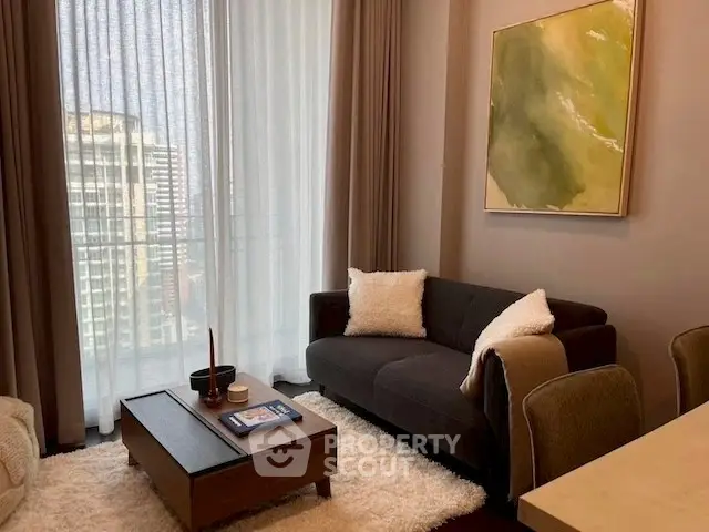 Modern living room with cozy sofa, stylish coffee table, and large window with city view.