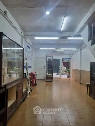 Spacious interior with tiled flooring and ample lighting, ideal for versatile real estate opportunities.