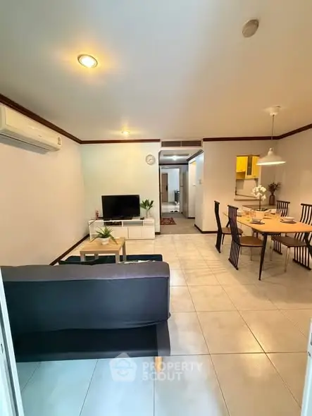 Spacious living and dining area with modern furnishings and ample natural light.