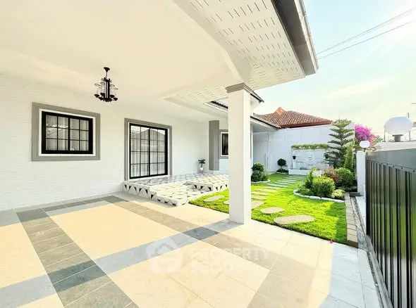 Charming modern home with spacious patio and lush garden, perfect for outdoor relaxation and entertaining.