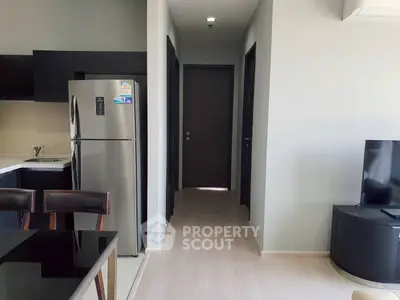 Modern apartment interior with sleek kitchen and cozy living area