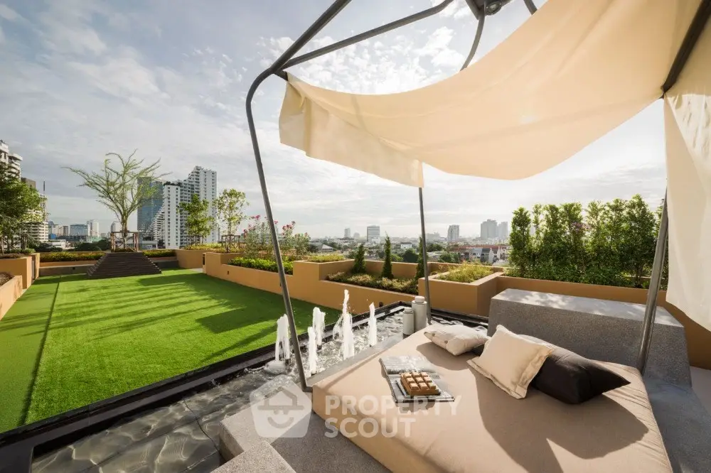 Luxurious rooftop terrace with stunning city views and modern lounge area.
