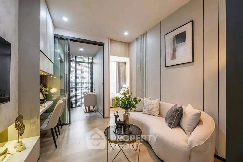 Stylish modern living room with elegant decor and cozy seating in a contemporary apartment.