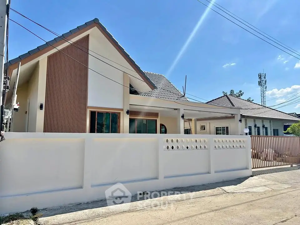 Charming modern house with unique facade and spacious driveway in a serene neighborhood.