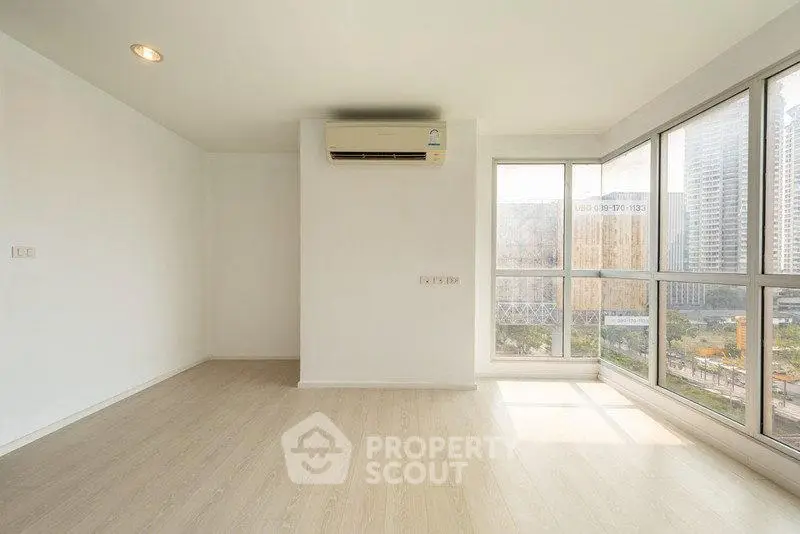 Spacious corner unit with large windows offering stunning city views, perfect for modern living.