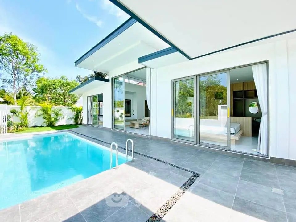 Luxurious modern villa with private pool and spacious patio, perfect for relaxation and entertaining.