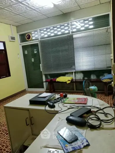 Cozy study room with vintage decor and ample natural light