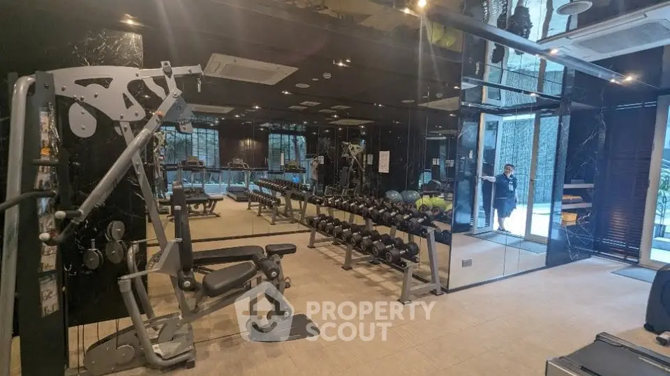 Luxurious gym with modern equipment in upscale residential building