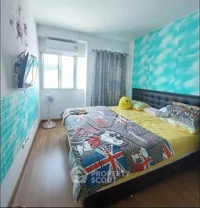Cozy bedroom with vibrant decor and natural light, featuring a comfortable bed and modern furnishings.