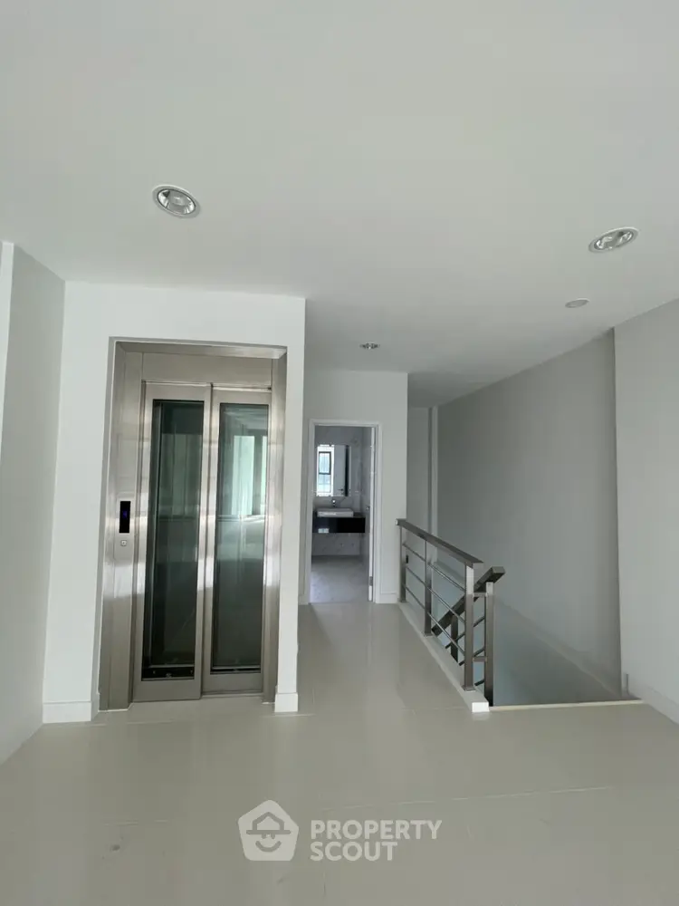 Modern interior with sleek elevator and minimalist design