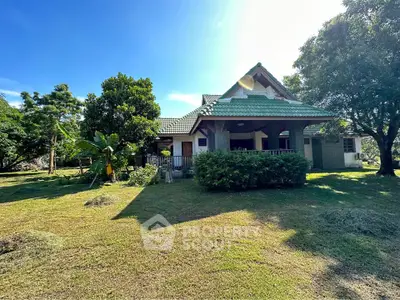 Charming countryside house with lush garden and traditional architecture, perfect for serene living.