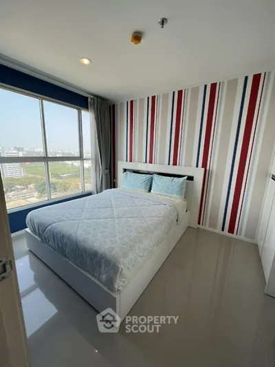 Modern bedroom with large window and city view in stylish apartment