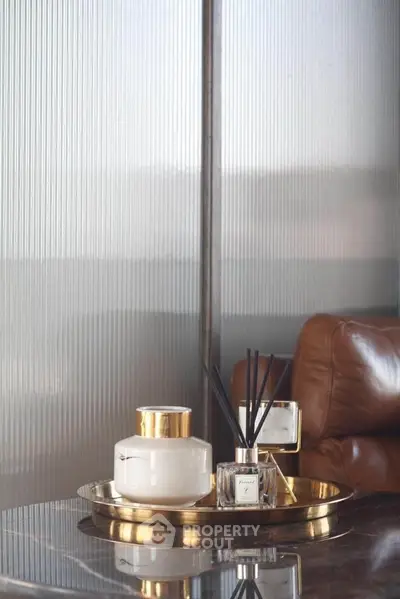 Luxurious interior with elegant decor and leather seating in modern living space.