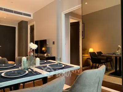 Elegant dining area with modern decor and cozy lighting in a stylish apartment.
