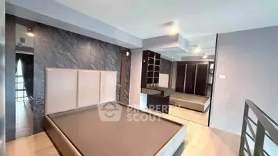 Modern bedroom with sleek design and mirrored wardrobe in luxury apartment
