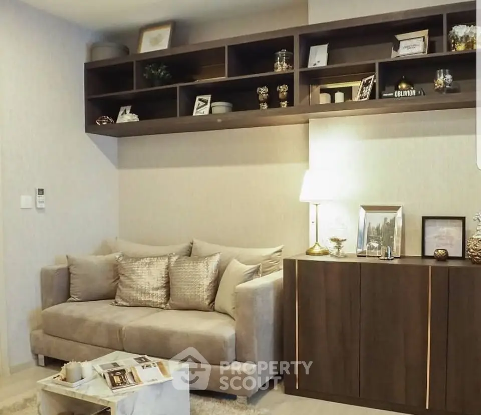 Stylish living room with cozy sofa and elegant shelving