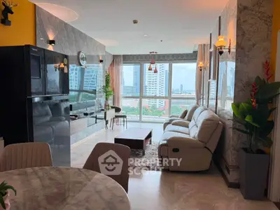 Luxurious living room with stunning city view, elegant decor, and plush seating in a high-rise apartment.