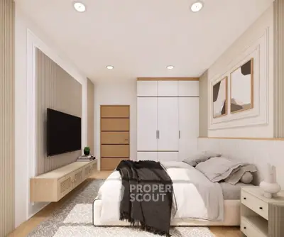 Modern bedroom with stylish decor, cozy bed, and wall-mounted TV in a bright, inviting space.