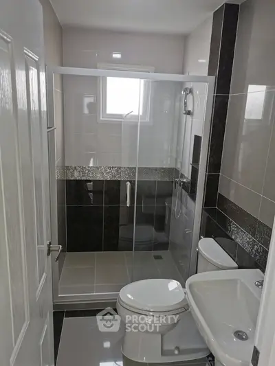 Modern bathroom with sleek shower enclosure and contemporary fixtures