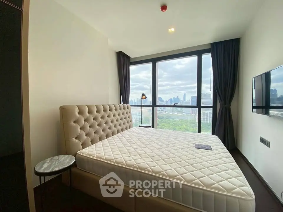 Luxurious bedroom with panoramic city view and elegant decor