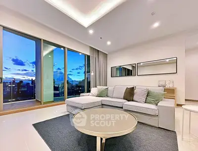 Modern living room with large windows and stunning city view