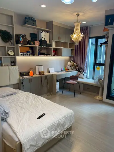 Luxurious bedroom with elegant chandelier and modern decor