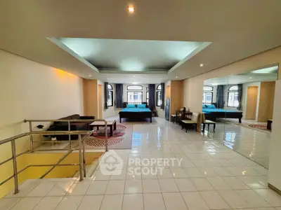 Spacious open-plan living area with modern design and ample natural light.