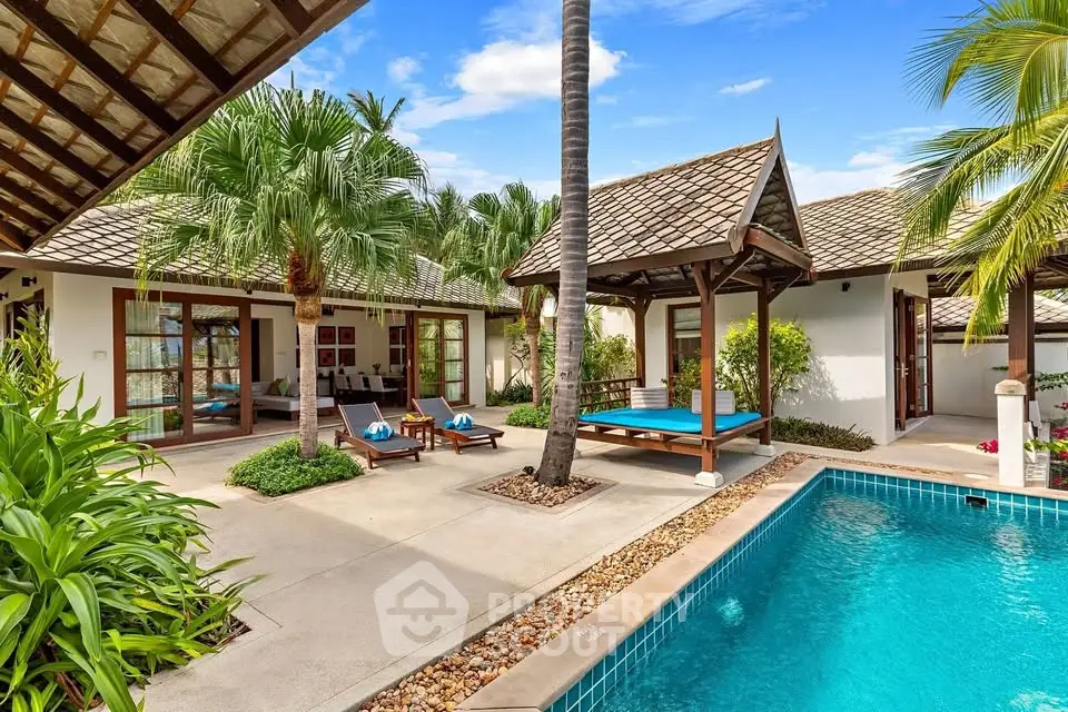 Luxurious tropical villa with private pool and lush garden, perfect for serene living and entertaining.
