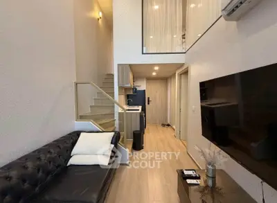 Modern duplex living room with sleek staircase and stylish decor