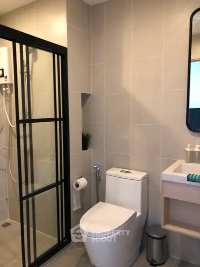 Modern bathroom with sleek shower enclosure and contemporary fixtures