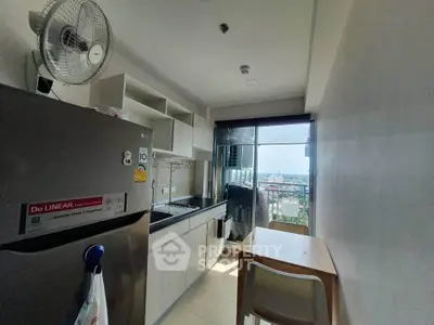 Modern kitchen with compact dining area and city view