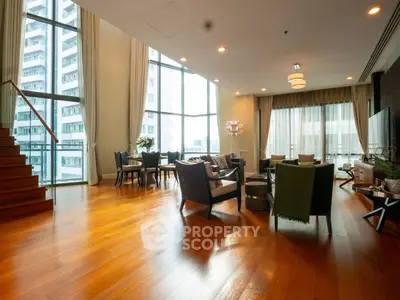 Luxurious spacious living room with floor-to-ceiling windows and elegant wooden flooring.