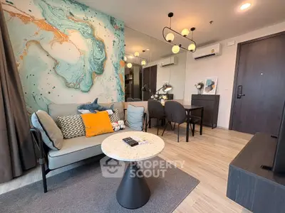 Stylish modern living room with artistic wall design and cozy seating area