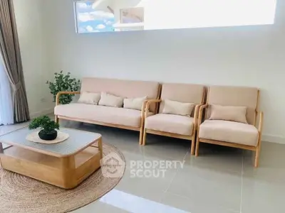 Modern living room with stylish beige furniture and natural light