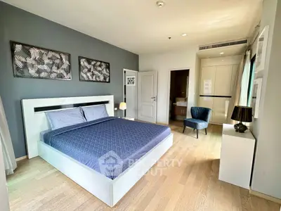 Spacious modern bedroom with elegant decor and natural light