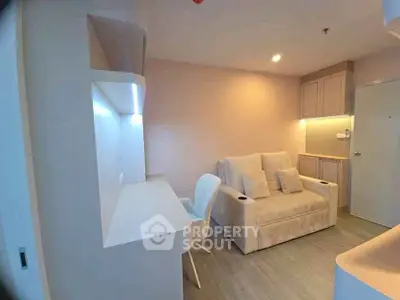 Modern living room with cozy sofa and sleek workspace in stylish apartment