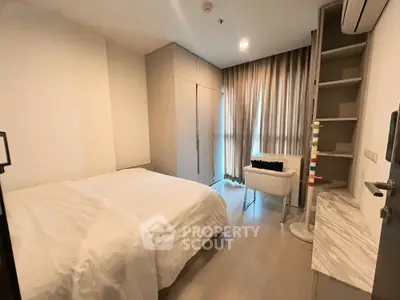 Modern bedroom with cozy white bedding and stylish decor