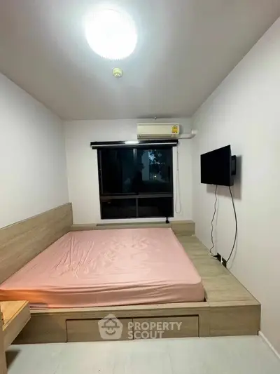Modern minimalist bedroom with built-in wooden bed and wall-mounted TV