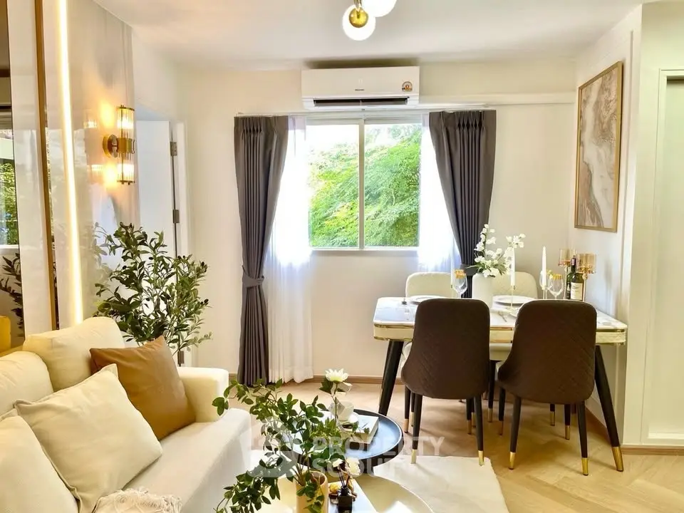 Chic living room with elegant dining area and lush greenery view, perfect for modern living.
