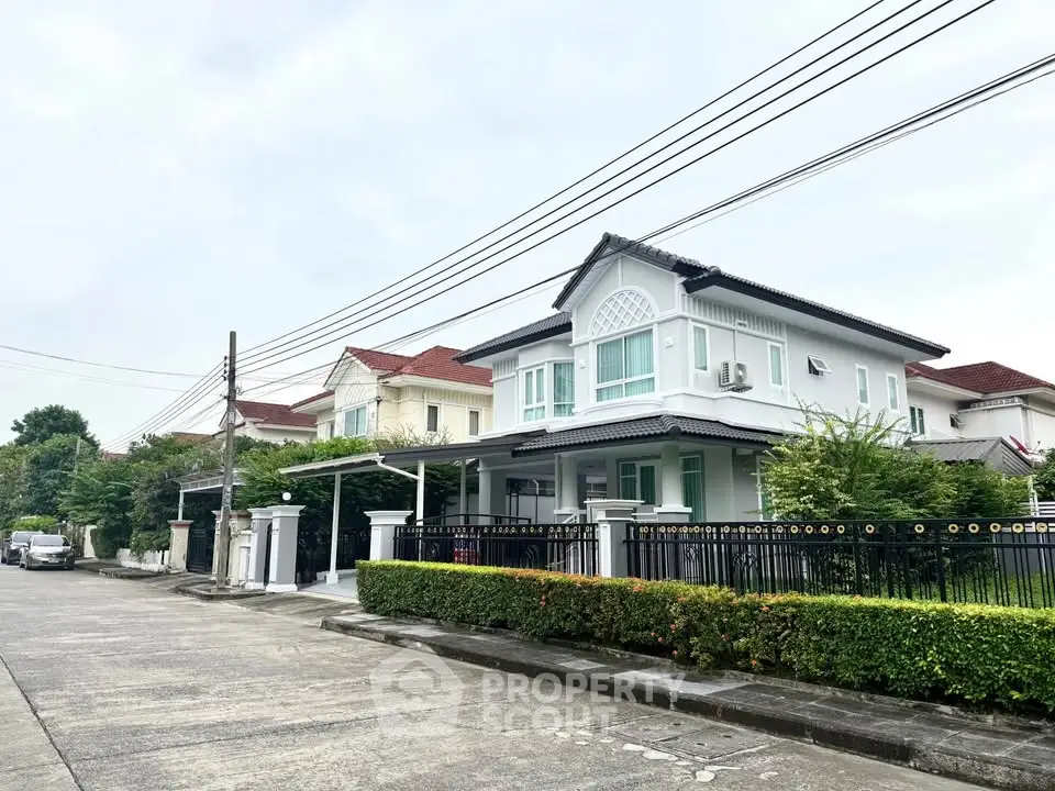 Charming suburban house with modern design and lush greenery