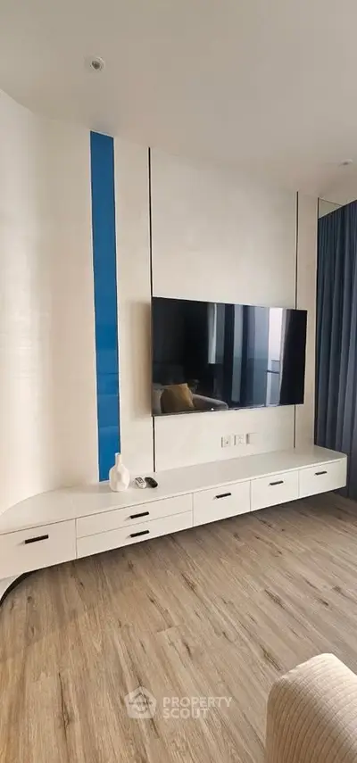 Modern living room with sleek TV setup and stylish decor