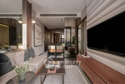 Modern living room with sleek furniture and large TV, perfect for urban living.