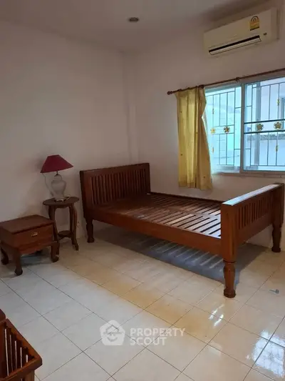 Cozy bedroom with wooden furniture and natural light