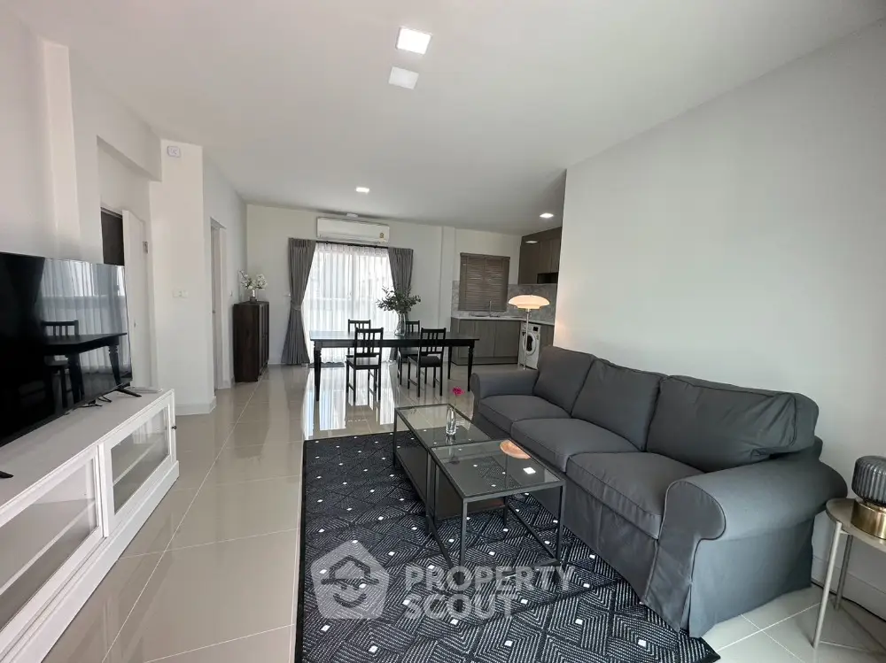 Spacious modern living room with sleek furniture and open layout